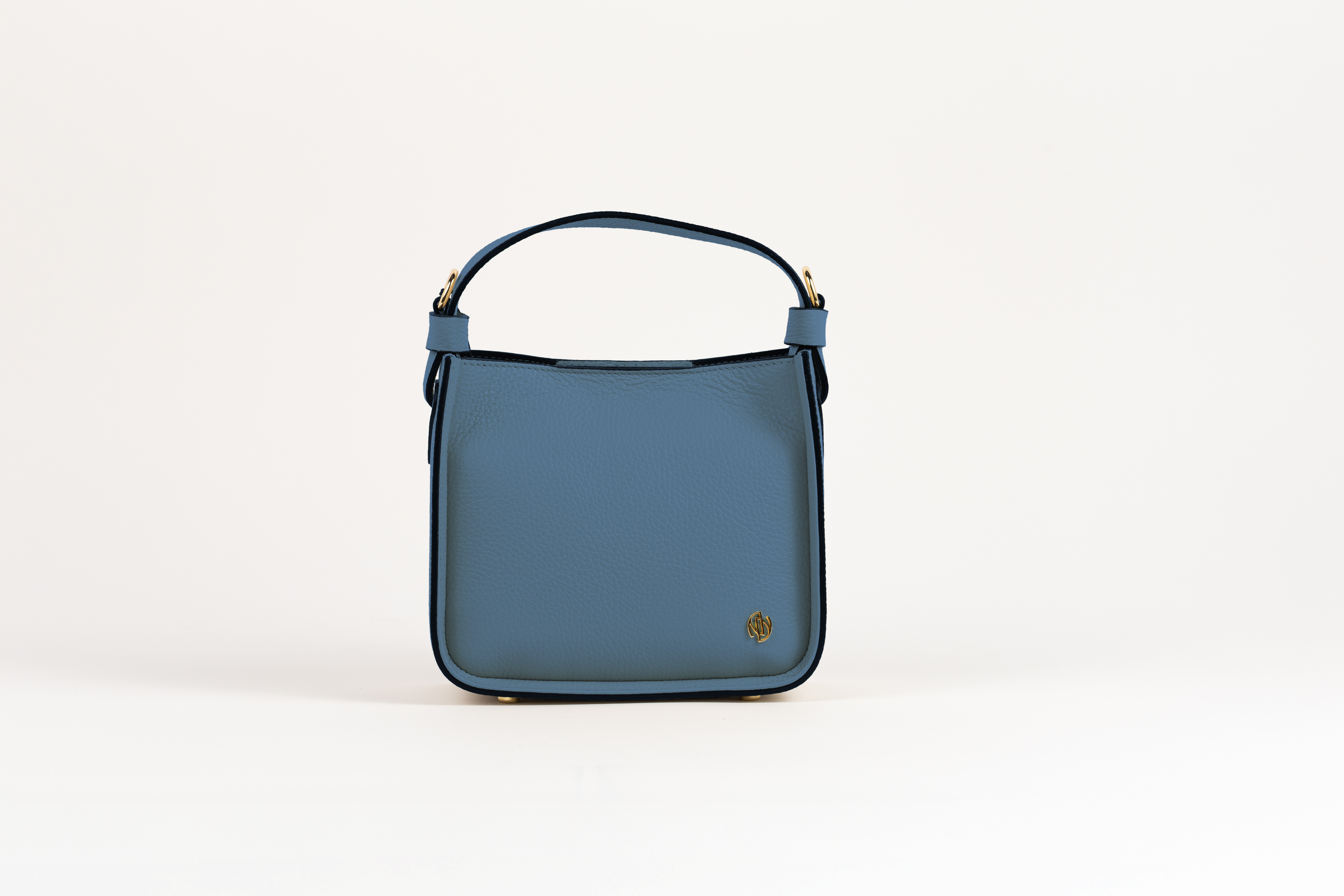 Affinée Élan Ocean handbag, straight front view with gold-tone monogram