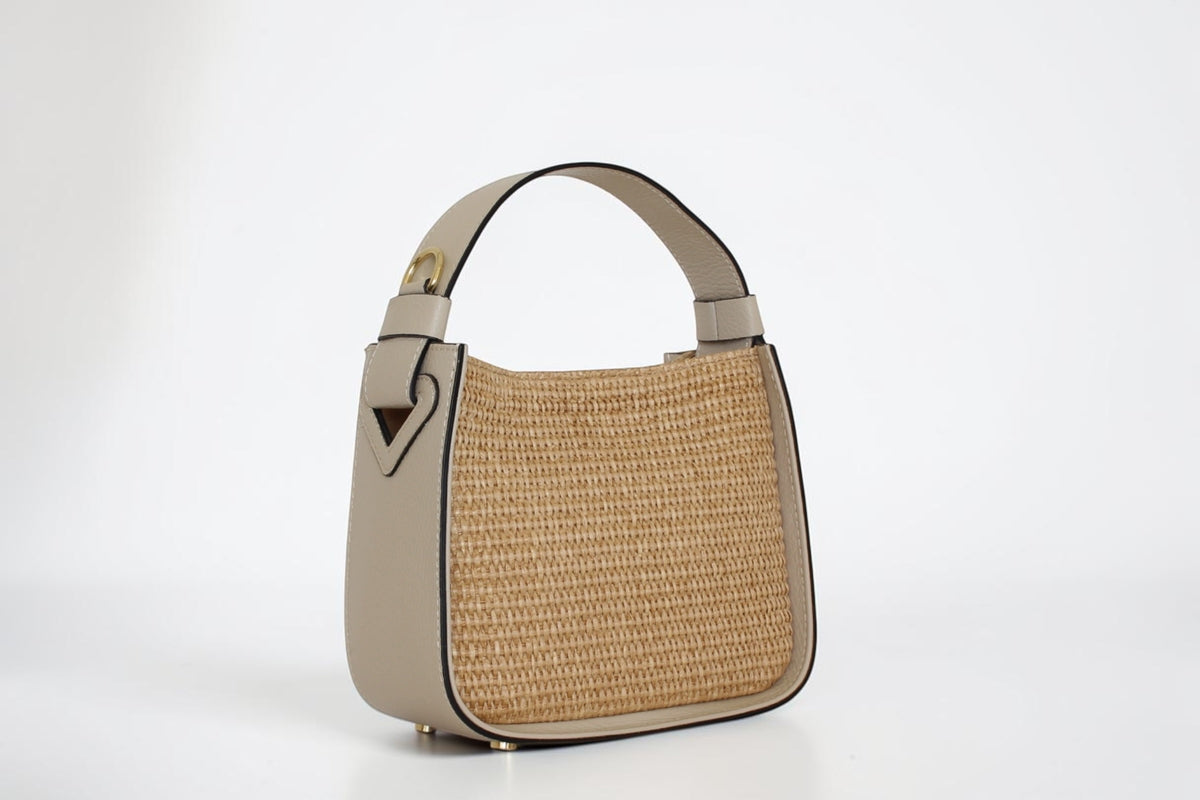 Affinée Élan Ivory handbag, three-quarter view showing the woven panel and leather side