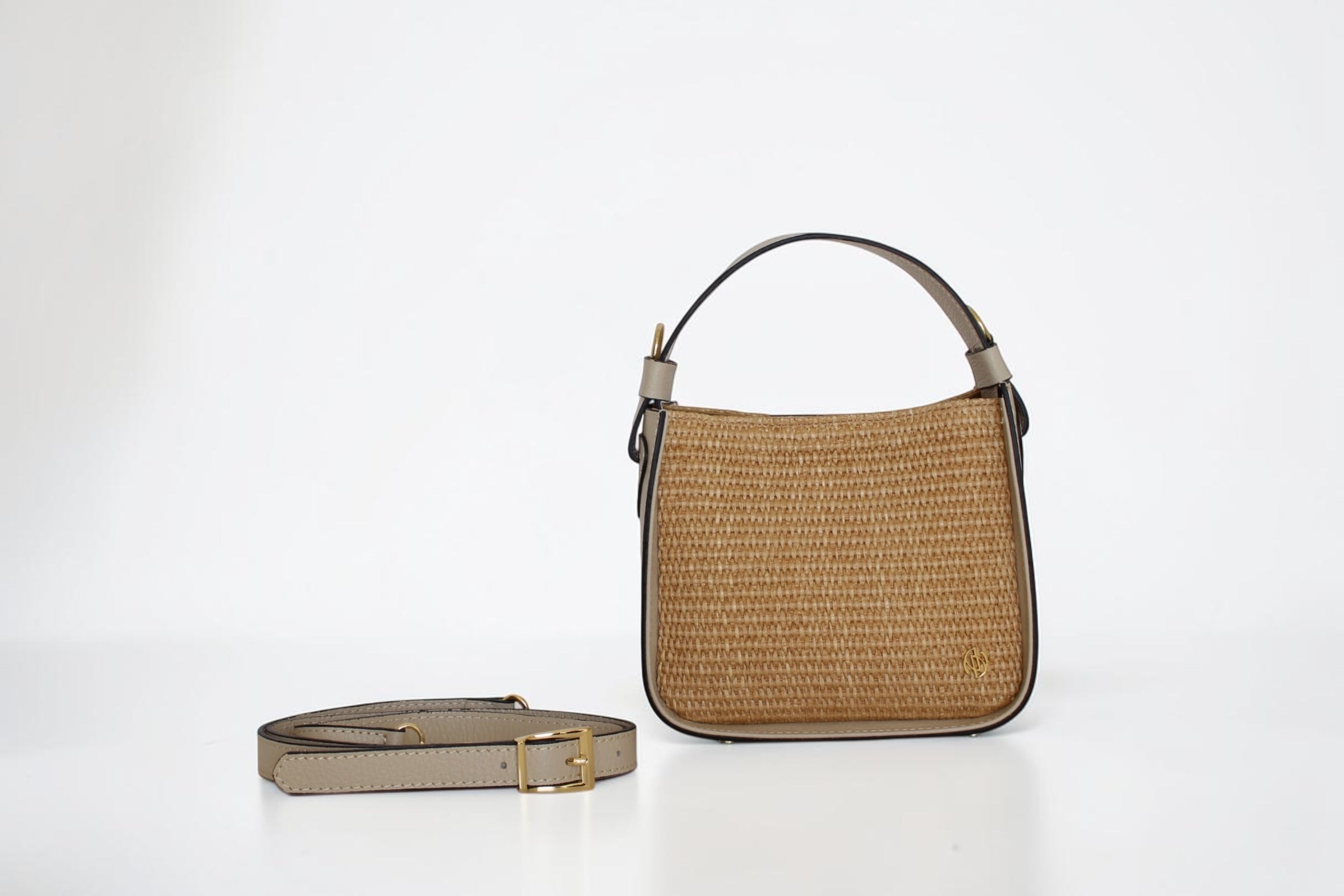 Affinée Élan Ivory handbag, woven panel with the shoulder strap placed beside it