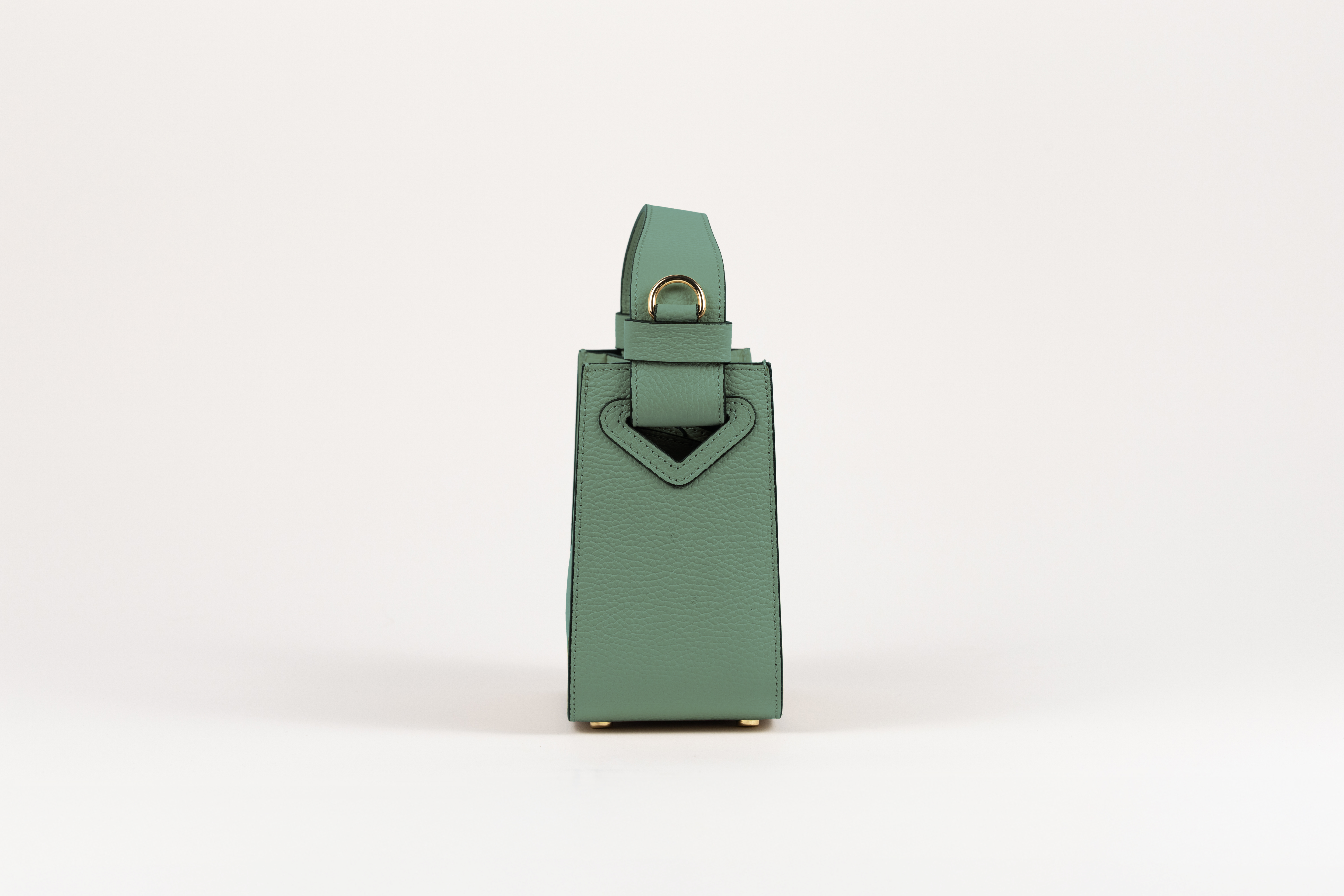 Affinée Élan Mint handbag, side profile showing the handle attachment
