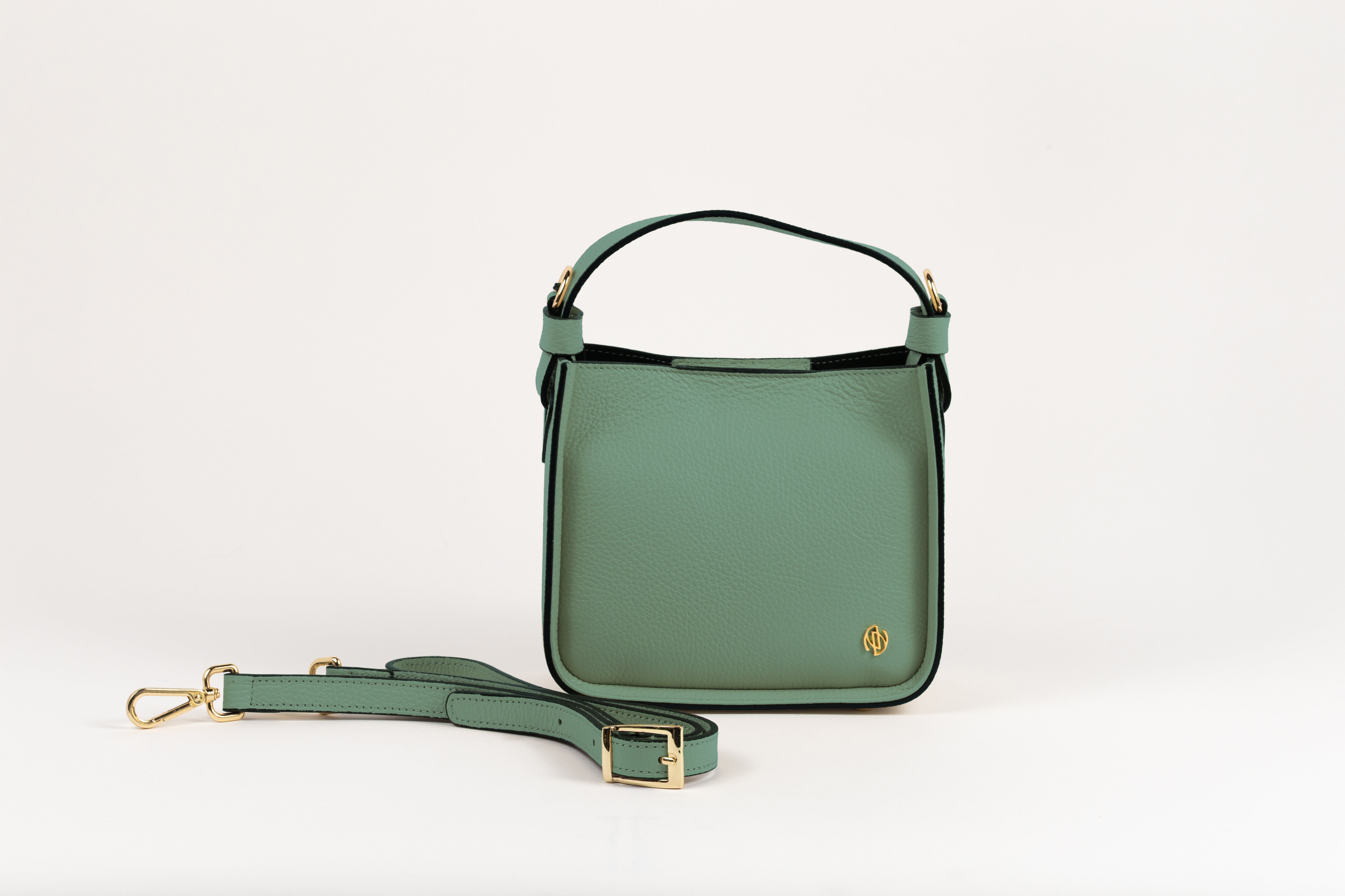 Affinée Élan Mint handbag, front view with the adjustable shoulder strap beside it